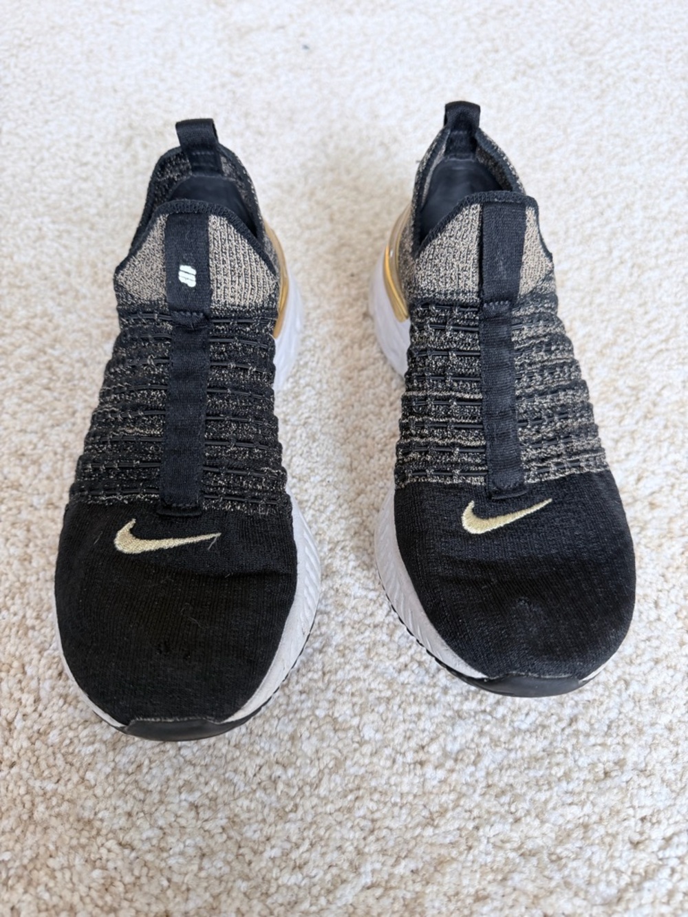 Nike Slip-On Knit Sneakers in Black and Gold Accent